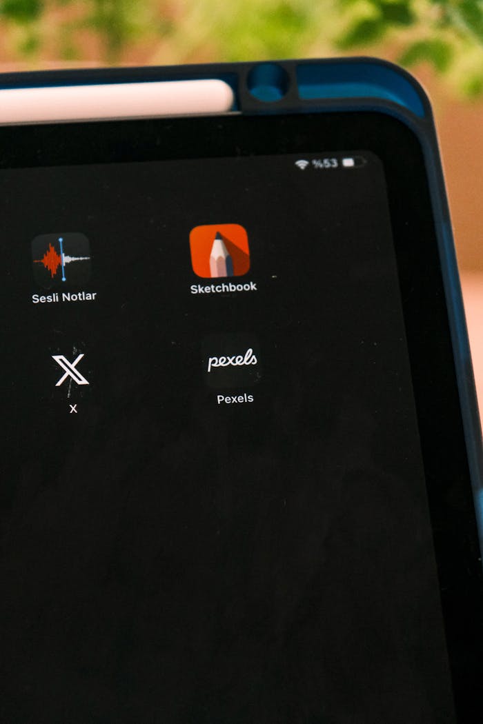 services-02 Tablet screen displaying various app icons including Sketchbook and Pexels.